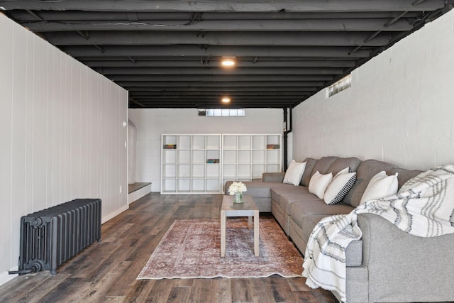 living room featuring radiator and wood finished floors