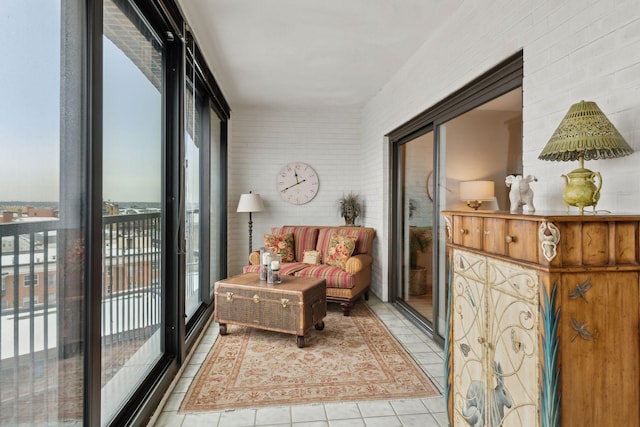 living area featuring a healthy amount of sunlight and tile patterned floors