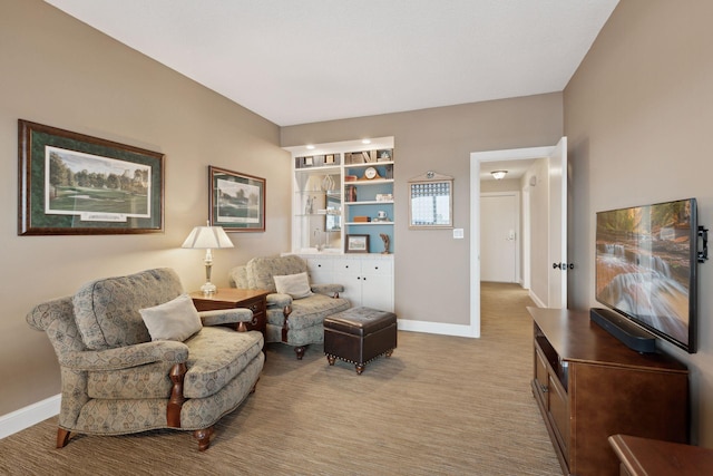 living area with carpet flooring and baseboards