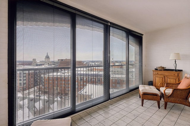 interior space with a city view and light tile patterned floors