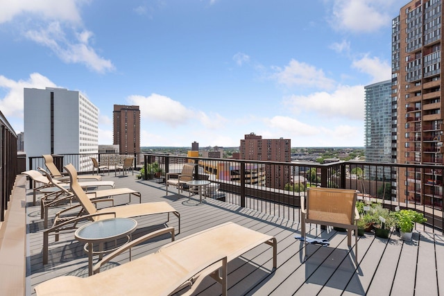 wooden terrace with a city view