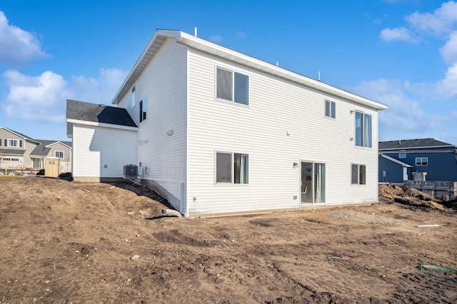 rear view of property featuring central air condition unit