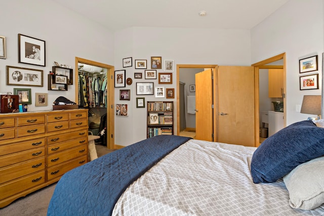 carpeted bedroom featuring a closet and a walk in closet