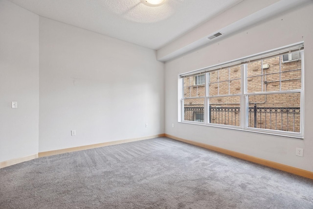 308 18th St Unit 101, Minneapolis, MN 55404 - carpeted spare room featuring visible vents and baseboards
