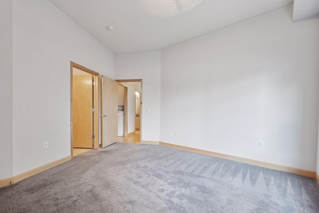308 18th St Unit 101, Minneapolis, MN 55404 - unfurnished room with baseboards and light carpet