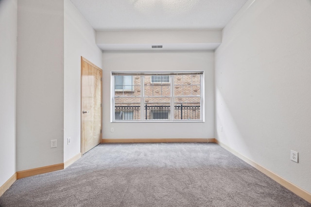 308 18th St Unit 101, Minneapolis, MN 55404 - unfurnished room with baseboards, carpet, and visible vents