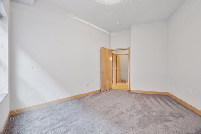 308 18th St Unit 101, Minneapolis, MN 55404 - carpeted spare room featuring baseboards