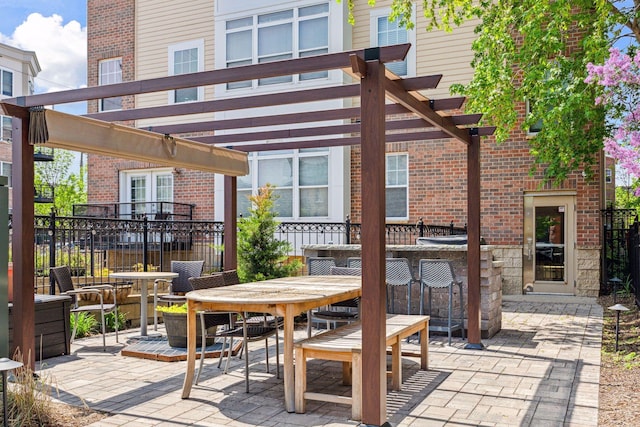 308 18th St Unit 101, Minneapolis, MN 55404 - view of patio with fence, outdoor dining area, outdoor dry bar, and a pergola