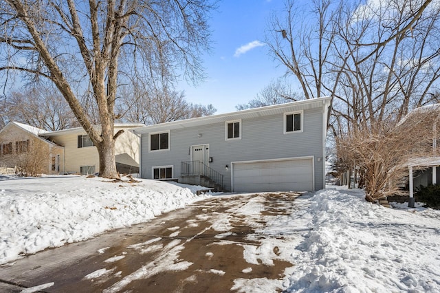 snow covered house with an attached garage