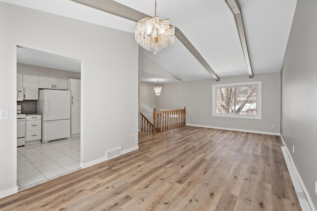 unfurnished living room featuring visible vents, light wood-style floors, and a chandelier