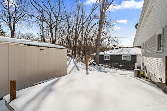 snowy yard with central air condition unit