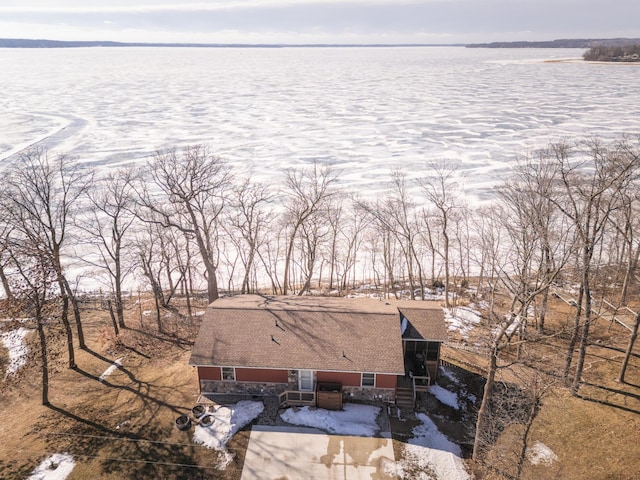 birds eye view of property featuring a water view