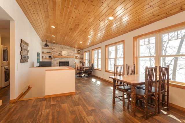 dining room with a fireplace, lofted ceiling, dark wood-type flooring, wooden ceiling, and baseboards