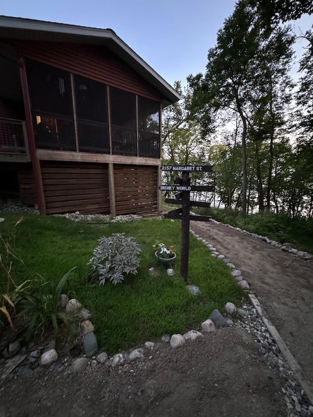 view of home's exterior featuring a sunroom