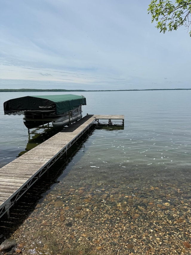 view of dock with a water view and boat lift