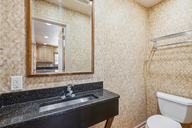 bathroom featuring toilet and a sink