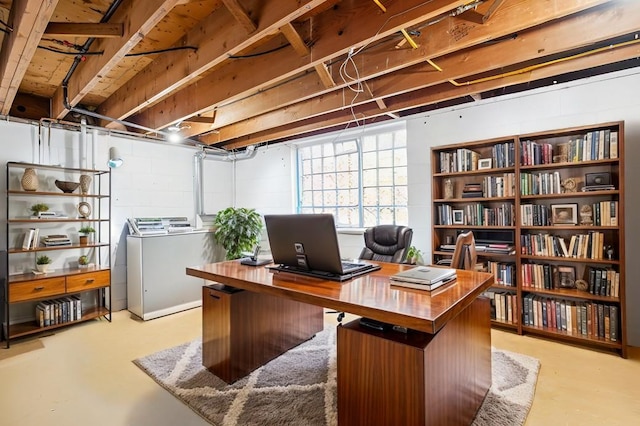 office area featuring concrete floors