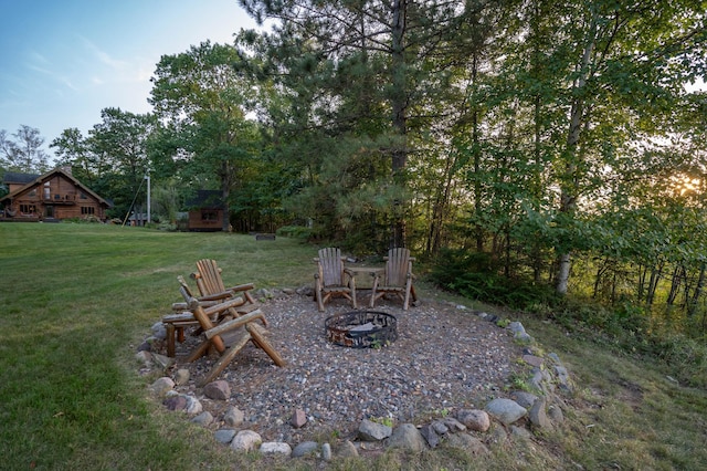 view of yard with an outdoor fire pit