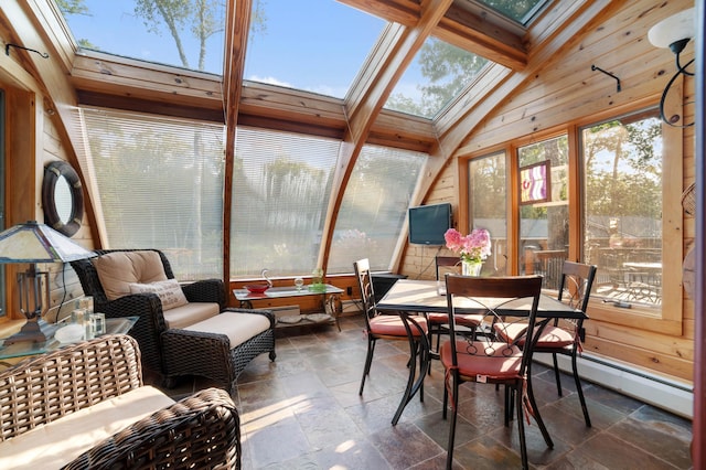 sunroom / solarium with vaulted ceiling with skylight