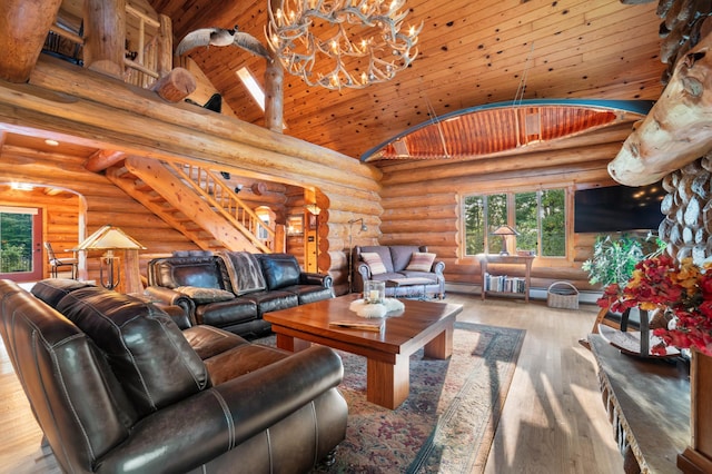 living area featuring wooden ceiling, wood-type flooring, stairs, high vaulted ceiling, and a notable chandelier