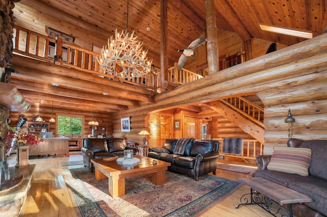 living room with wooden ceiling, hardwood / wood-style floors, high vaulted ceiling, and a notable chandelier