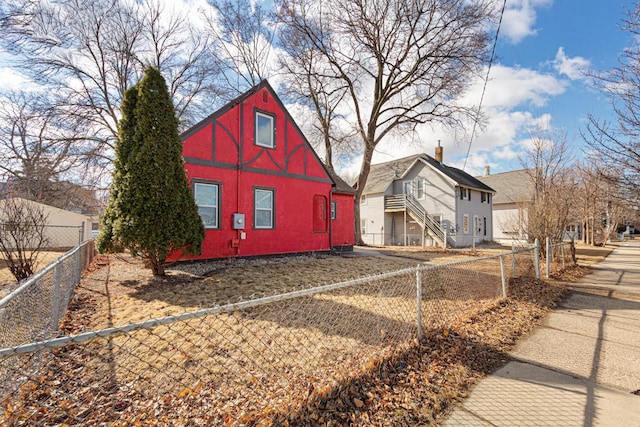 view of home's exterior featuring a fenced front yard and stucco siding