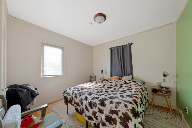 bedroom with baseboards and light wood-style floors