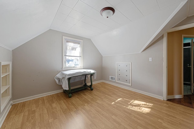 bonus room with visible vents, baseboards, light wood-type flooring, and lofted ceiling