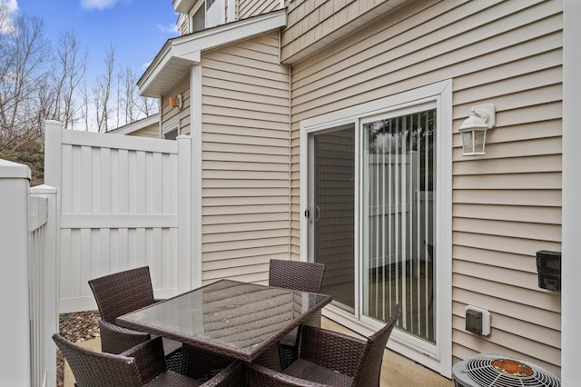 view of patio / terrace featuring outdoor dining space and central AC unit