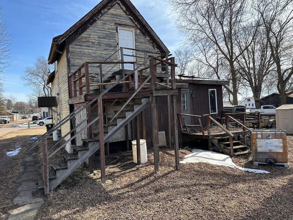 back of property with stairs