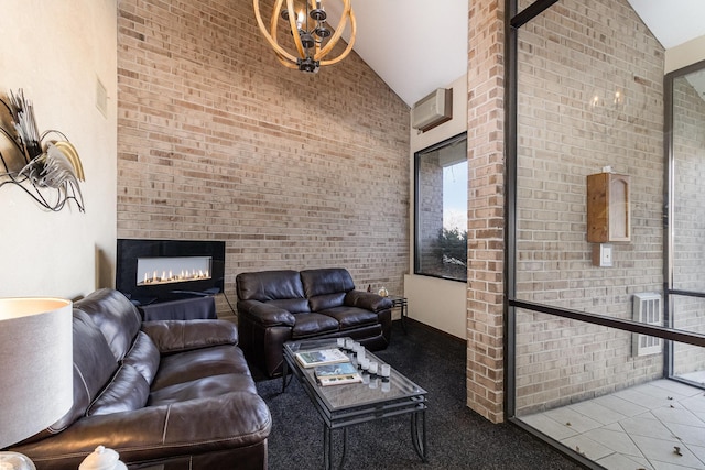 unfurnished living room with high vaulted ceiling, a glass covered fireplace, and a wall mounted AC