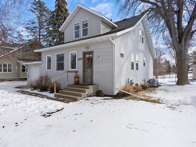 bungalow-style home with a garage