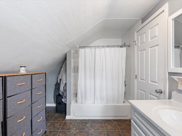 full bath featuring lofted ceiling, shower / bath combo, vanity, and a textured ceiling