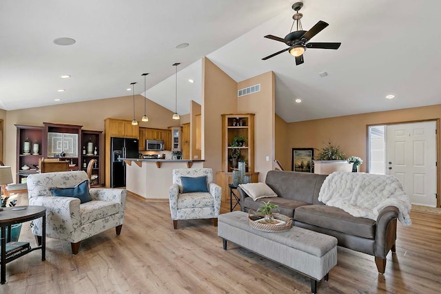 living area with a ceiling fan, visible vents, light wood finished floors, high vaulted ceiling, and recessed lighting