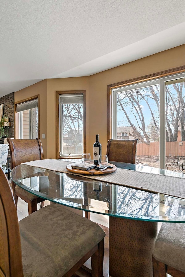 dining room featuring a textured ceiling