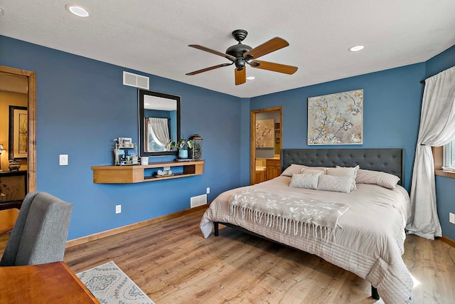 bedroom featuring visible vents, wood finished floors, recessed lighting, baseboards, and ceiling fan