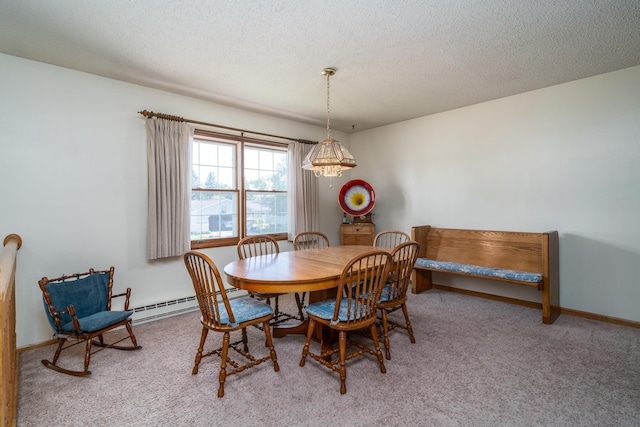 dining room featuring a textured ceiling, a baseboard radiator, carpet flooring, and baseboards