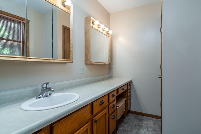 bathroom featuring vanity and baseboards