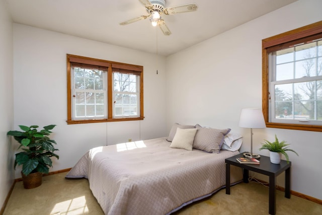 bedroom with baseboards, carpet floors, and ceiling fan