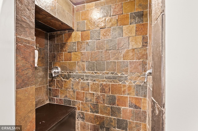 bathroom with tiled shower