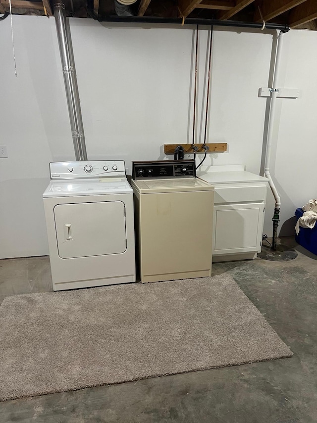 washroom with laundry area and separate washer and dryer