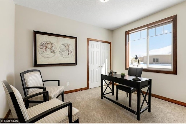 home office with light carpet, visible vents, baseboards, and a textured ceiling