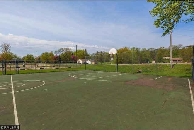 view of sport court featuring community basketball court and fence