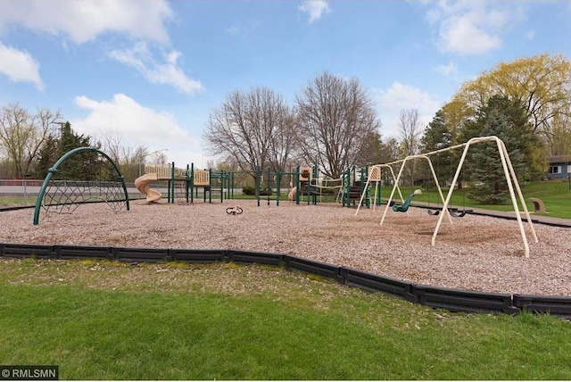 community play area with a lawn