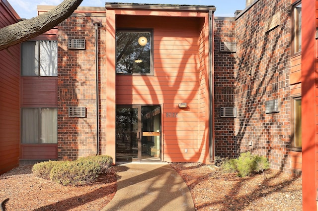 exterior space featuring brick siding