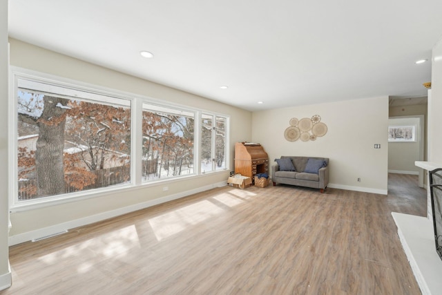 unfurnished room featuring baseboards, recessed lighting, visible vents, and light wood-style floors