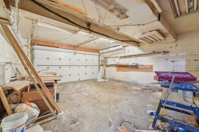 garage featuring concrete block wall