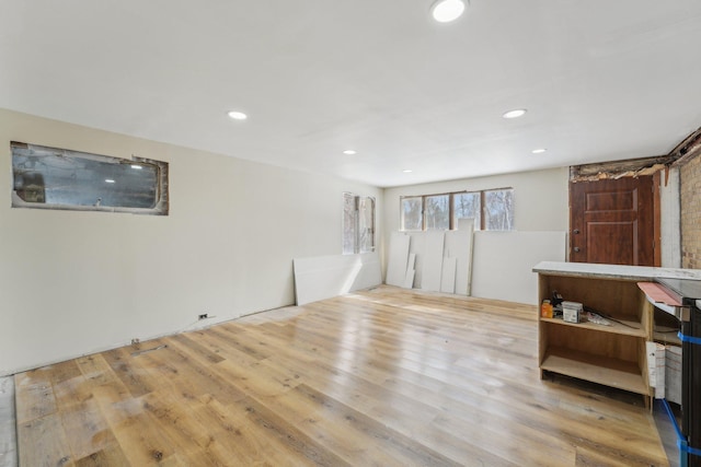 spare room featuring wood finished floors and recessed lighting