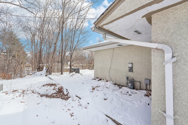 view of yard layered in snow