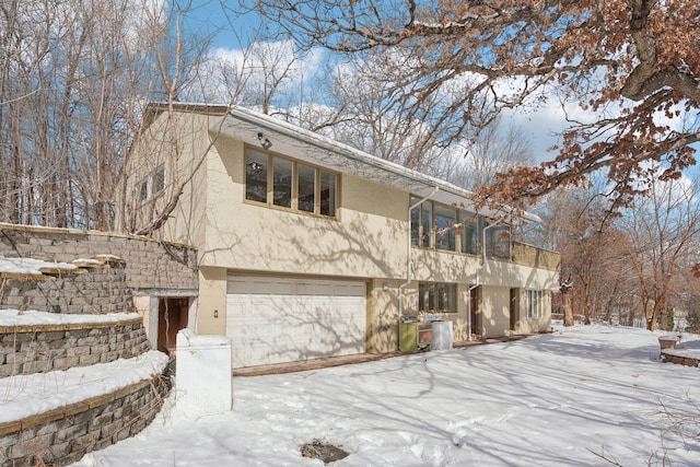 view of front facade featuring an attached garage and stucco siding